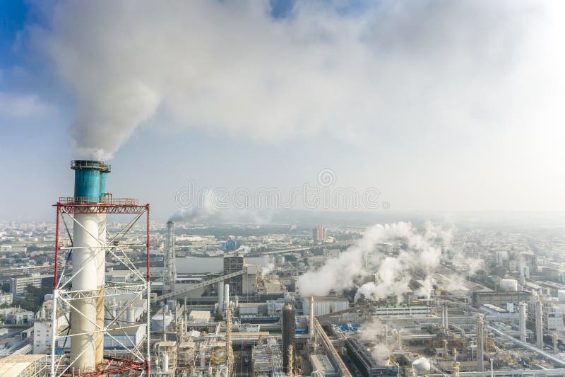 Aerial view of industrial area with chemical plant. Smoking chimney from factory