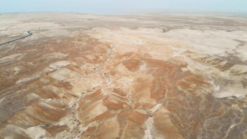 Aerial view of the Judean desert. Flying over desert lands near the dead sea. Jordan Israel Palestine