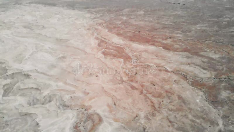Aerial view of the Judean desert located on the West Bank of the Jordan river. Deserted shore of dead sea. The