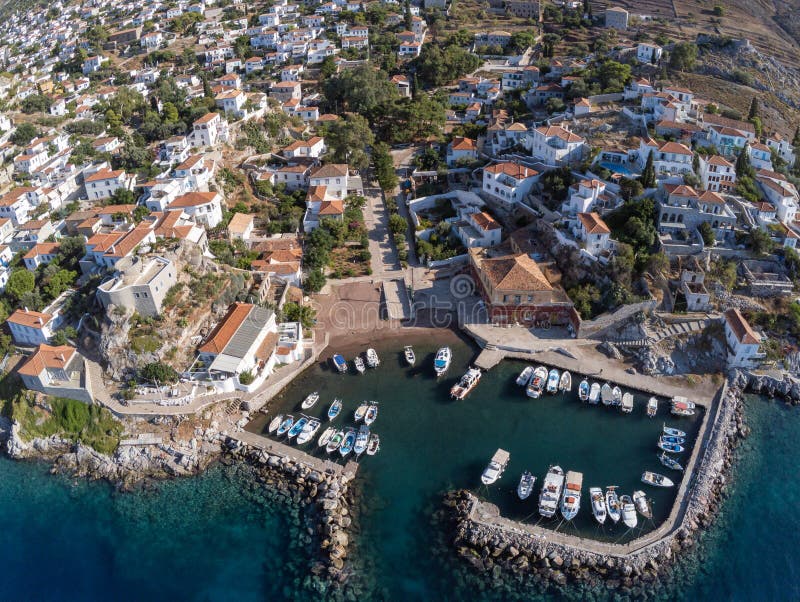 Aerial view of Kamini village, pier and beach in Hydra Island