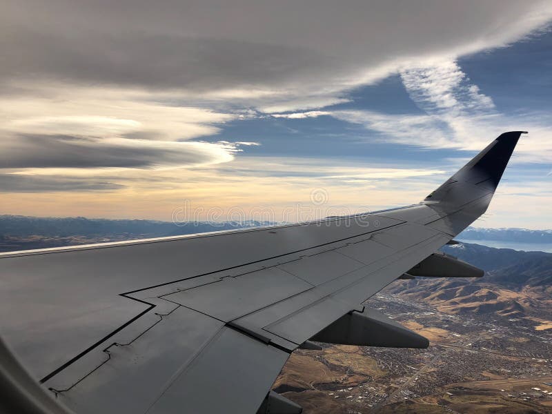 Sunset and airplane wing over Lake Tahoe and Reno. Aerial view of Lake Tahoe and Washoe Lake outside of Reno, Nevada stock photo Sunset and airplane wing over Lake Tahoe and Reno. Aerial view of Lake Tahoe and Washoe Lake outside of Reno, Nevada stock photo