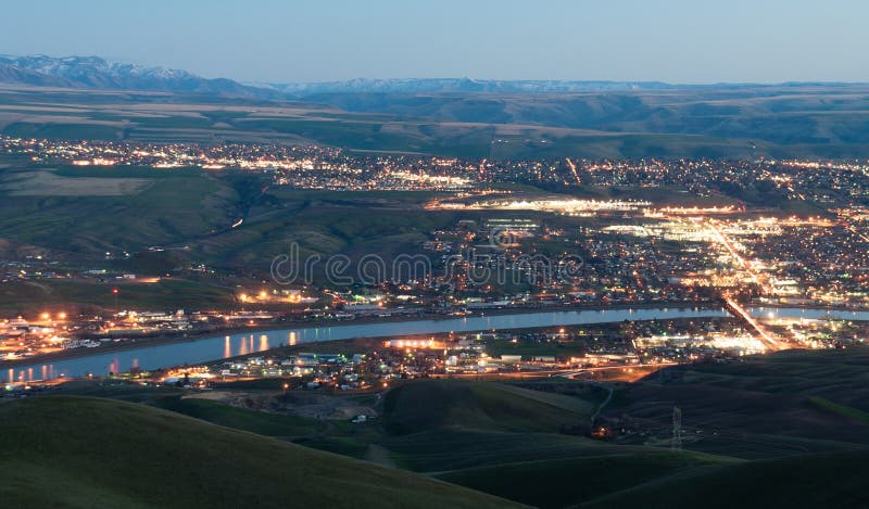 Dusk comes to Lewiston downtown and reflects its light in the Clearwater and Snake Rivers Idaho North America. Dusk comes to Lewiston downtown and reflects its light in the Clearwater and Snake Rivers Idaho North America
