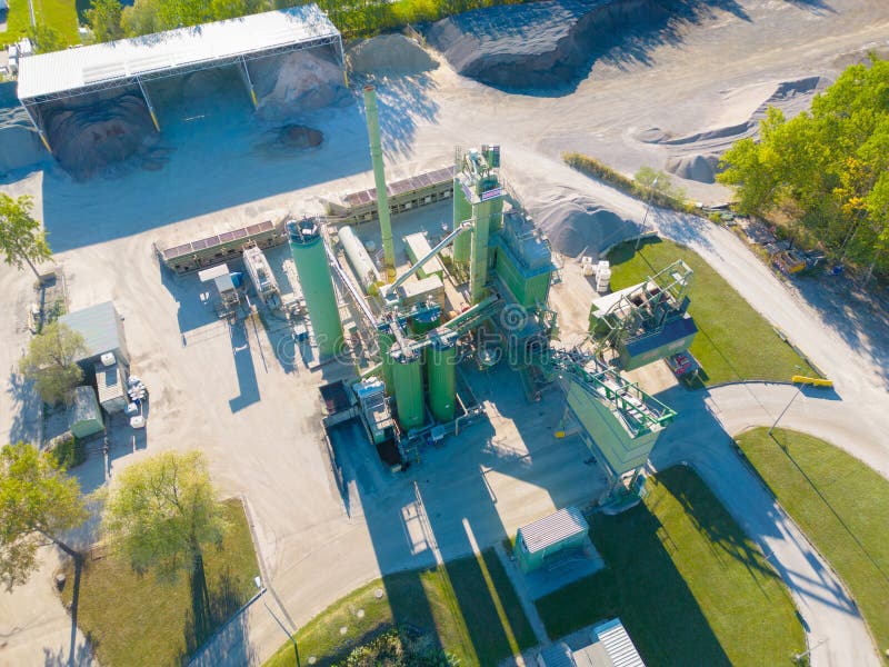 Aerial view of the logistics park with warehouse, loading hub and many semi trucks with cargo trailers standing at the ramps for royalty free stock image