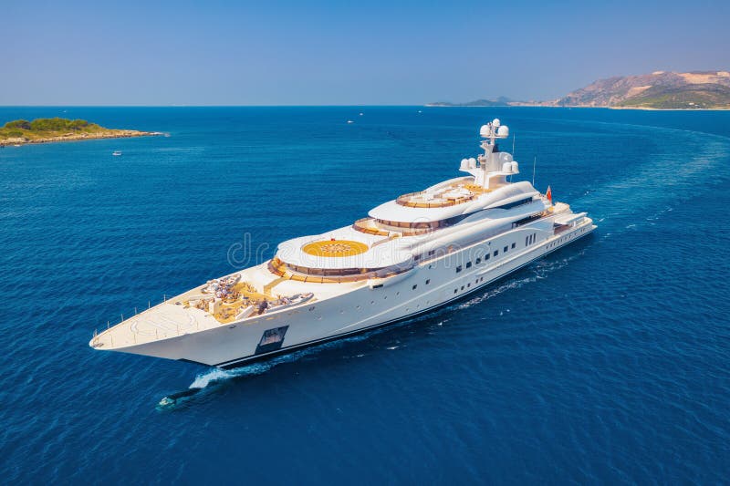Aerial view of luxury yacht and blue sea at sunny bright day