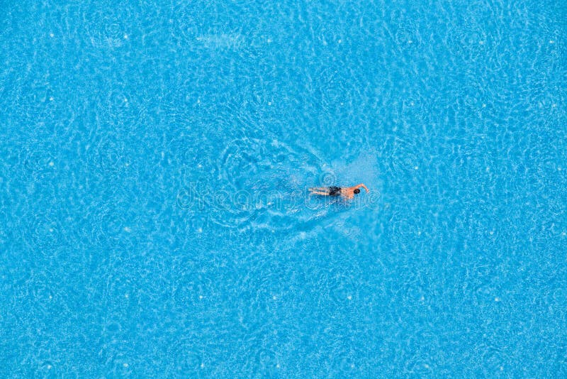 Aerial view of a man swimming in the pool