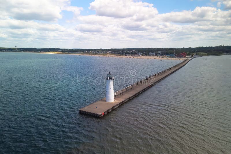 Manistee light house at lake Michigan shore line