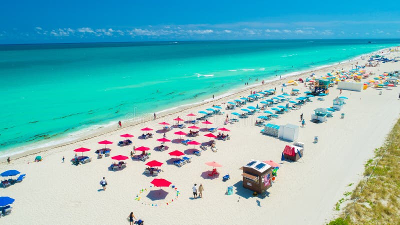 Aerial view of Miami Beach, South Beach famous place. Summer day Atlantic ocean. Colors Umbrella beach. Aerial view of Miami Beach, South Beach famous place. Summer day Atlantic ocean. Colors Umbrella beach.