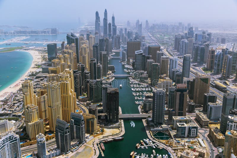 Aerial View of Modern Skyscrapers and Sea in the Background, Dubai, UAE. Stock Image - Image of drone, background: 118765545 Aerial View of Modern Skyscrapers and Sea in the Background, Dubai, UAE. Stock Image - Image of drone, background: 118765545