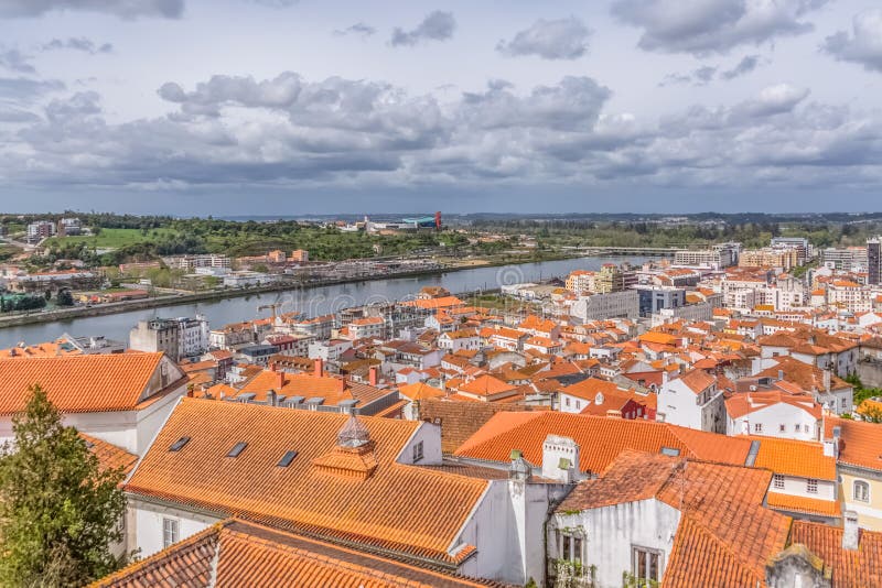 Aerial view on Mondego river and banks with Coimbra city, sky with clouds as background, in Portugal stock photo Aerial view on Mondego river and banks with Coimbra city, sky with clouds as background, in Portugal stock photo