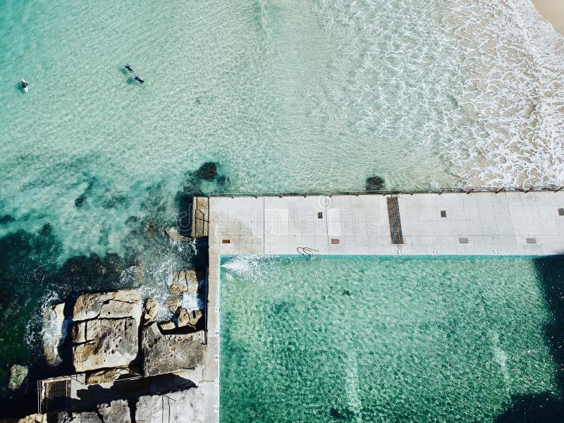 Aerial view of Ocean pool with crushing waves