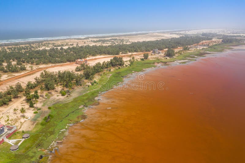 Aerial view of the pink Lake Retba or Lac Rose in Senegal. Photo made by drone from above. Africa Natural Landscape