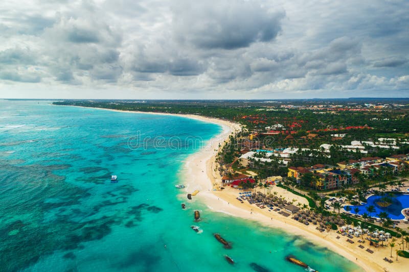 Aerial view of Punta Cana beach resort, Dominican Republic. Summer holiday with parasailing, diving, swimming, sunbathing. Aerial view of Punta Cana beach resort, Dominican Republic. Summer holiday with parasailing, diving, swimming, sunbathing.