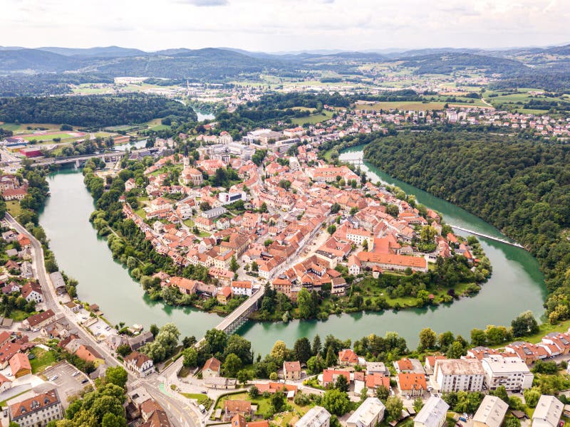 Aerial view of red roofs of Novo Mesto, Slovenia. Historic Kandija iron bridge Old Bridge, on the bend of the Krka River.