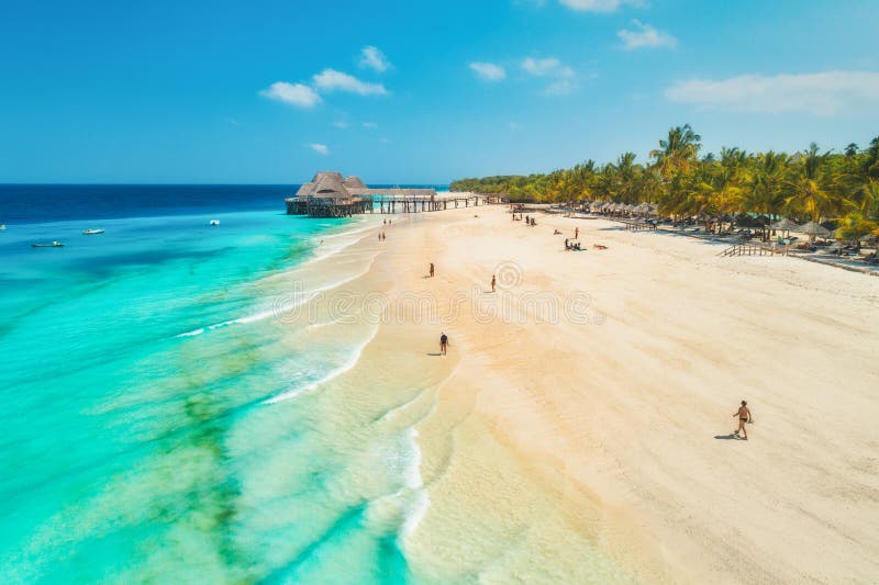 Aerial view of sandy beach of Indian Ocean at sunset.