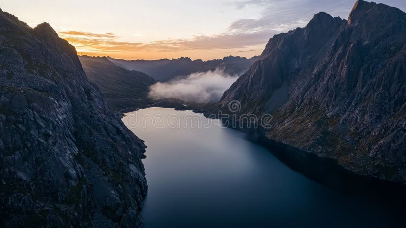 Aerial view of a serene mountain lake at sunrise stock photography