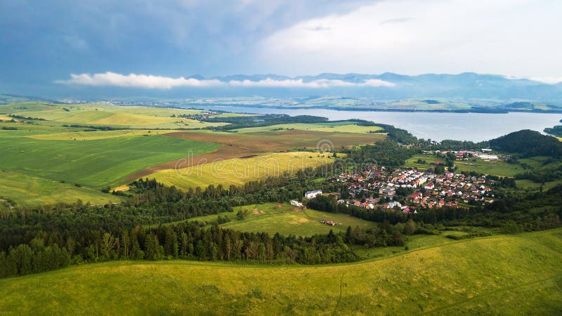 Aerial view of a small village in Slovakia with lake, in the Tatra Mountains