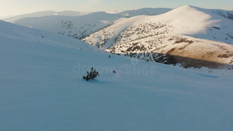 Aerial view snowboard snowy mountain winter forest with chair lift ski resort stock video footage