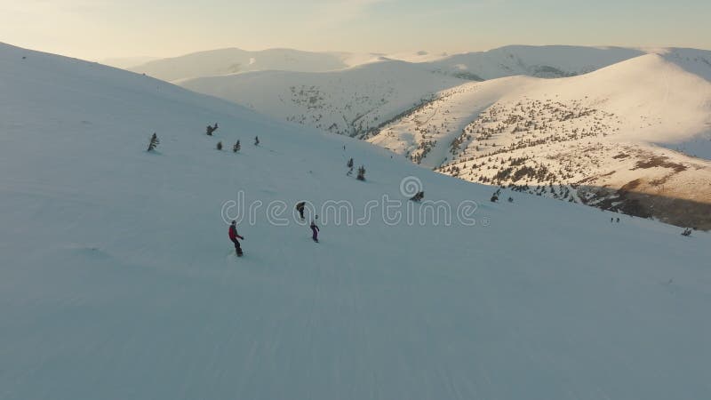 Aerial view snowboard snowy mountain winter forest with chair lift ski resort stock video