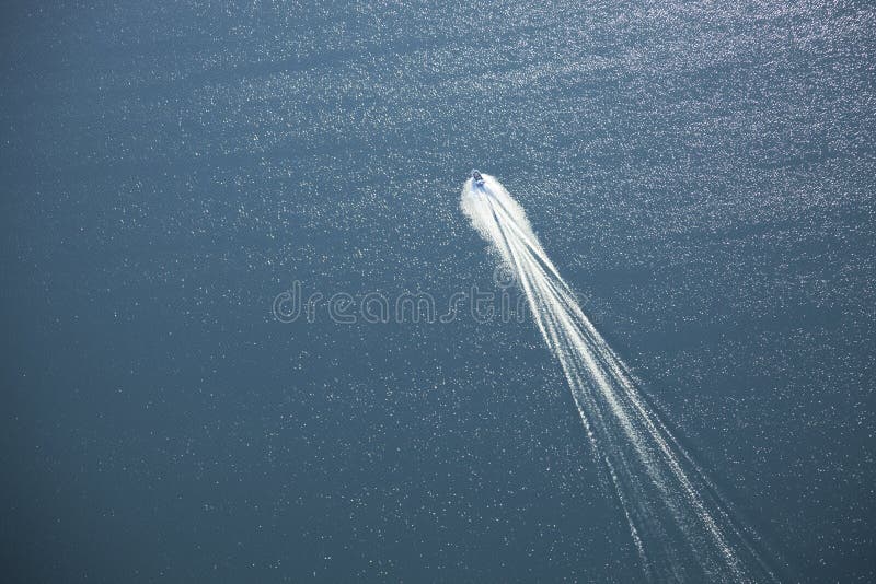 Aerial view of speedboat leaving white wake on a lake royalty free stock photography