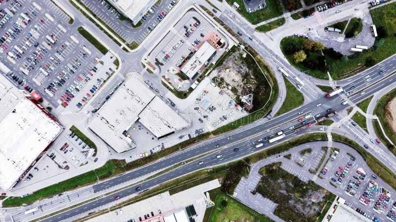 Aerial view of supermarkets, car parks and roads.