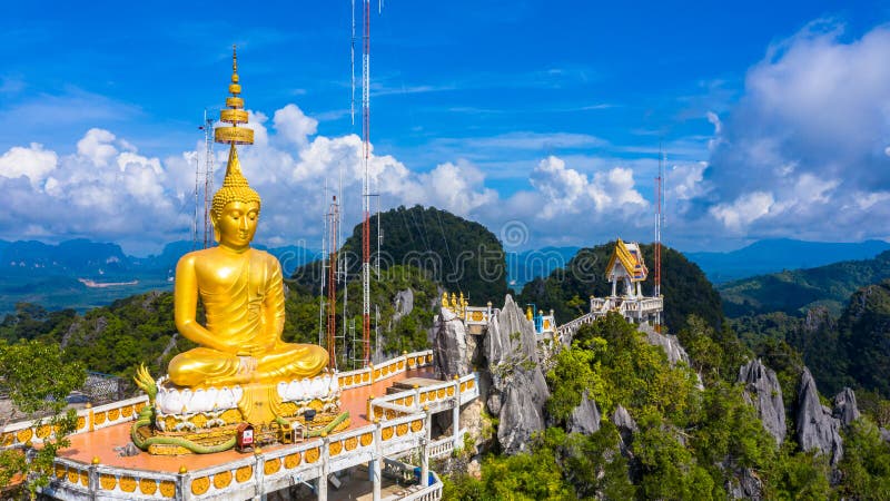 Aerial view Tiger Cave Temple, Buddha on the top Mountain with blue sky of Wat Tham Seua, Krabi,Thailand