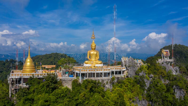 Aerial view Tiger Cave Temple, Buddha on the top Mountain with blue sky of Wat Tham Seua, Krabi,Thailand