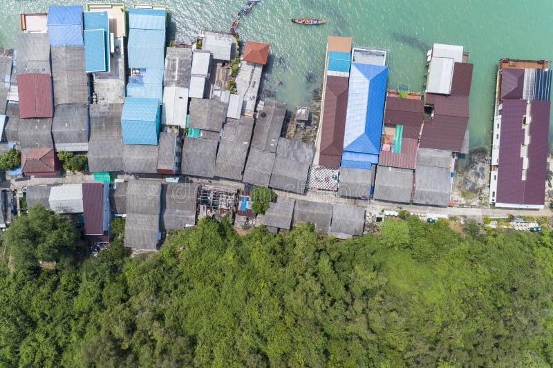 Aerial view top view of the fisherman village with fishing boats and house’s roof at the pier in koh rat suratthani Thailand royalty free stock image Aerial view top view of the fisherman village with fishing boats and house’s roof at the pier in koh rat suratthani Thailand royalty free stock image