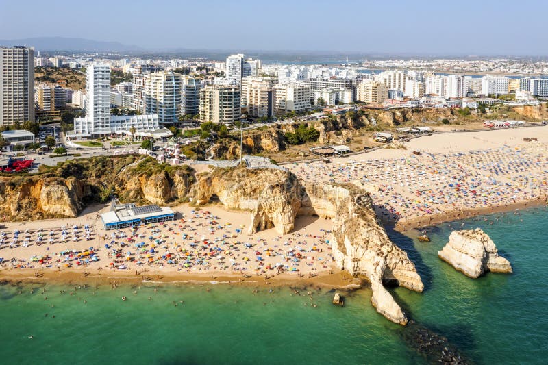 Aerial view of touristic Portimao with wide sandy Rocha beach, Algarve, Portugal