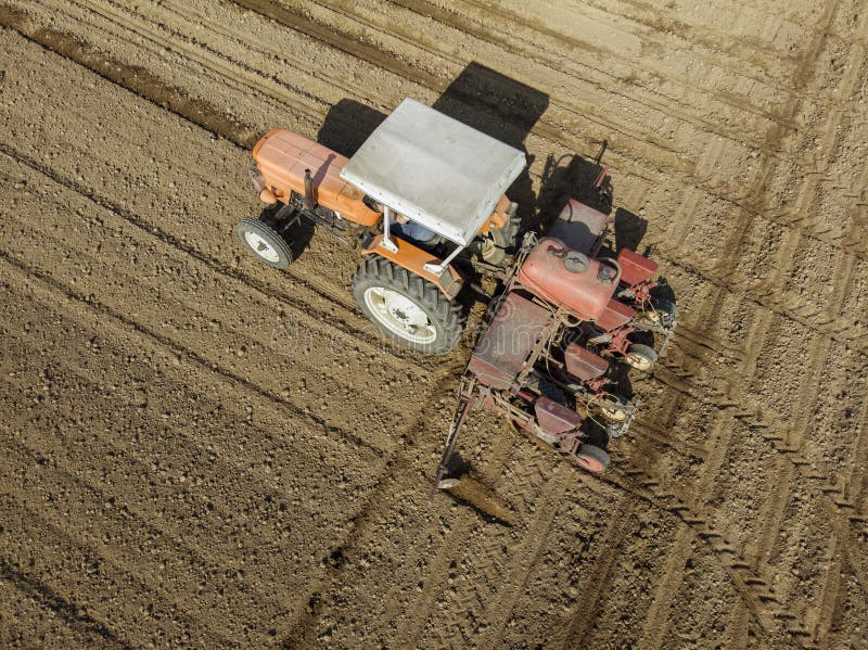 Aerial view of a tractor plowing the fields, aerial view, plowing, sowing, harvest. Agriculture and Farming, campaign. stock photography Aerial view of a tractor plowing the fields, aerial view, plowing, sowing, harvest. Agriculture and Farming, campaign. stock photography