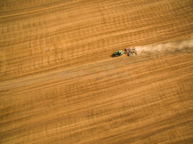 Aerial view of a tractor working a field royalty free stock photo