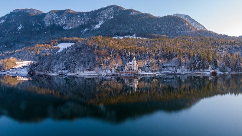 Aerial view on trees covered with snow in Hallstatt, Austria. Top view on forest in winter