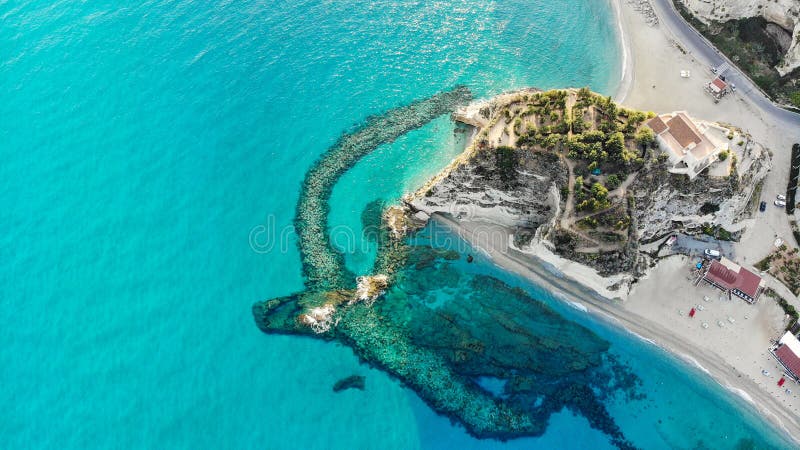 Aerial view in Tropea Italian town in Calabria with the Breakwaters in front of Santa Maria dell Isola Monastery royalty free stock photo Aerial view in Tropea Italian town in Calabria with the Breakwaters in front of Santa Maria dell Isola Monastery royalty free stock photo