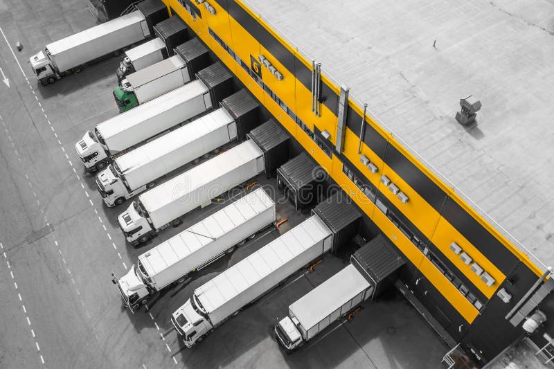 Trucks Loading in the Distribution Hub Stock Photo Image of building, truck 219344780