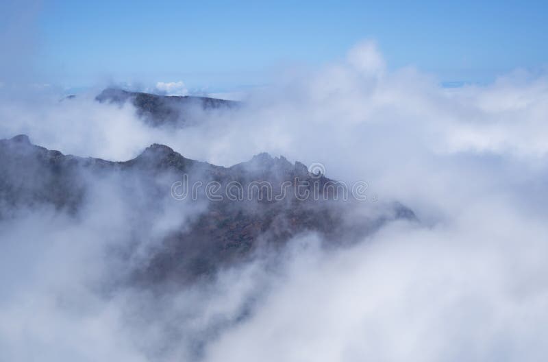 Aerial view of volcanic peaks emerging from the clouds, Pico do Arieiro, Madeira Portugal royalty free stock photos Aerial view of volcanic peaks emerging from the clouds, Pico do Arieiro, Madeira Portugal royalty free stock photos