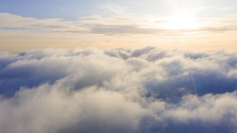 Aerial view White clouds in blue sky. Top view. View from drone. Aerial bird`s eye view. Aerial top view cloudscape. Texture of c