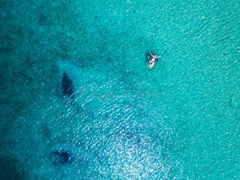 Aerial View of Woman Floating on the Water Mattress in the Sea Stock ...