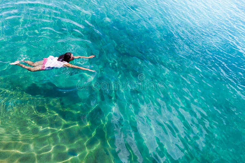 Aerial view of a woman in the sea stock image Aerial view of a woman in the sea stock image