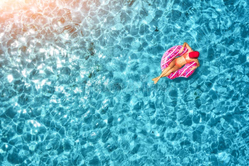 Aerial View of Woman Swimming on Donut Swim Ring in the Sea Stock Photo ...