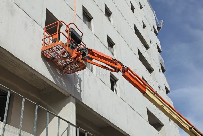 Aerial Work Platform Along the Façade of a Concrete Building Stock