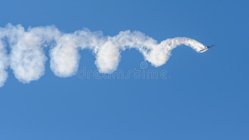 Aerobatic plane on display , Jurgis Kairys aerobatic pilot flying on blue sky