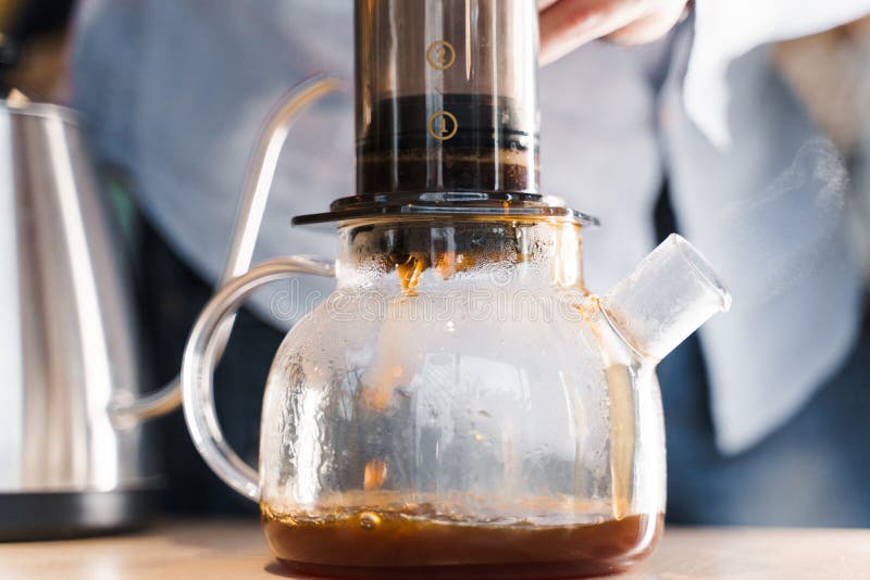 Aeropress Coffee and Glass Pot Close-up: Barista Press To Device and Coffee  Drops Pours Trought Aeropress To Pot Stock Photo - Image of method, coffee:  222093800