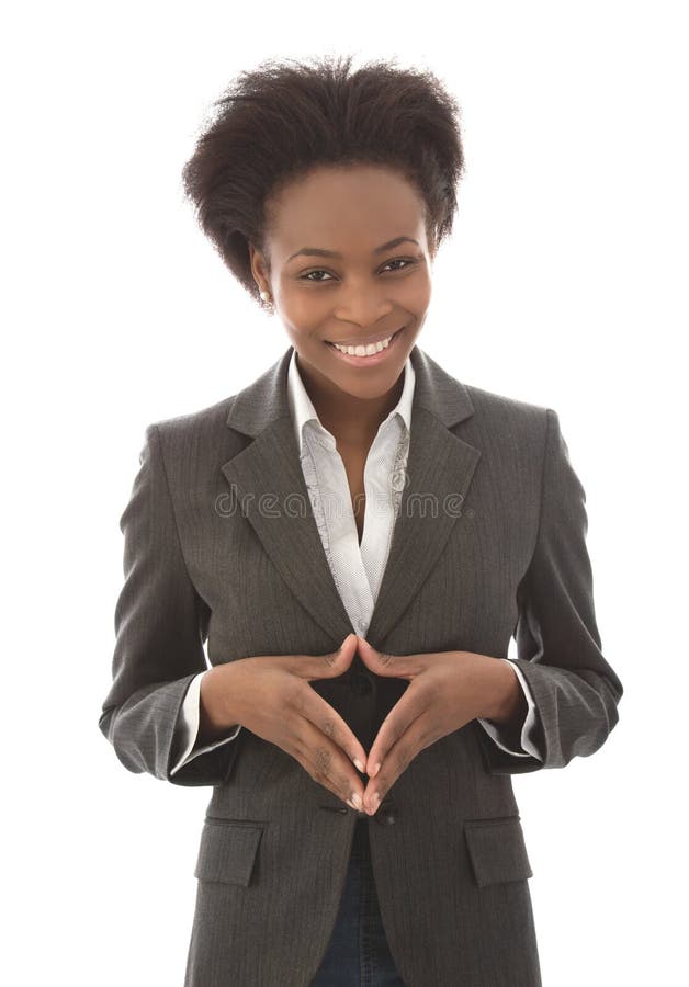 Affaires : femme de couleur satisfaisante regardant l'appareil-photo d'isolement sur le wh images stock Affaires : femme de couleur satisfaisante regardant l'appareil-photo d'isolement sur le wh images stock