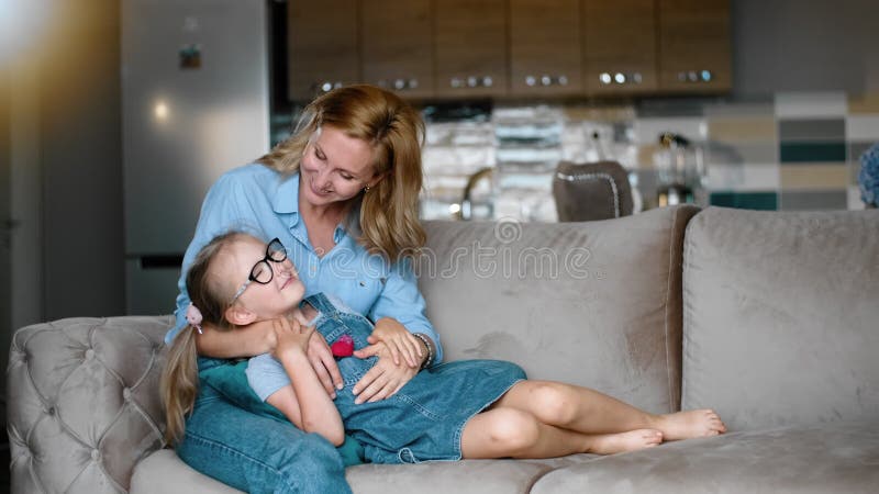 Affectionate Loving Mother and Kid Daughter on Sofa Kiss and Embrace Rbbro. Happy Joyful Family Stock Video - Video of affection, cheerful: 192178693