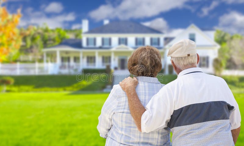 Happy Senior Couple From Behind Looking at Front of House. Happy Senior Couple From Behind Looking at Front of House.