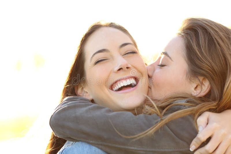 Woman Laughing Perfect Teeth Friend Kissing Her Stock Photos - Free ...