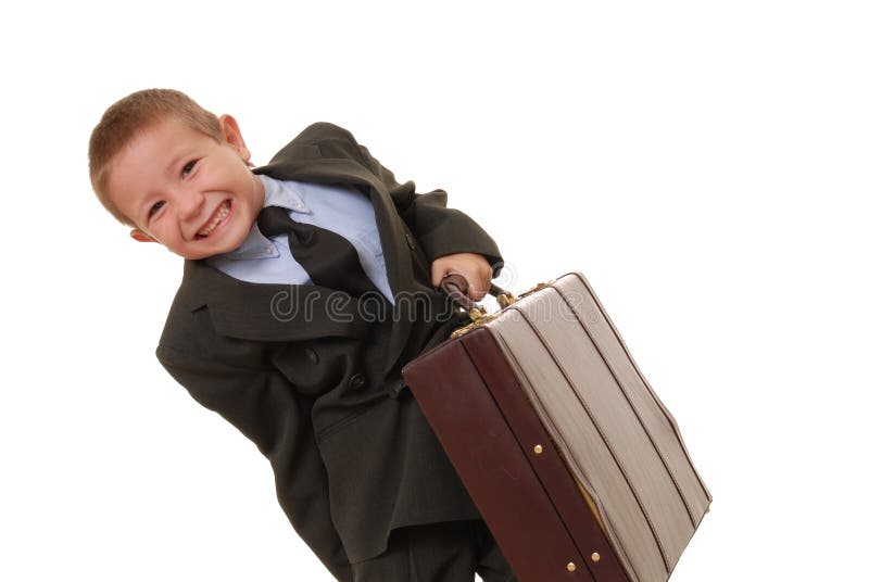 Young boy businessman carrying briefcase. Young boy businessman carrying briefcase