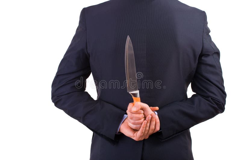 Business man holding knife behind his back. Business man holding knife behind his back.