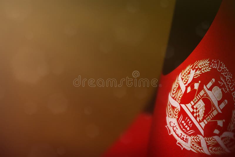 Afghanistan flag for honour of veterans day or memorial day. Glory to the Afghanistan heroes of war concept on orange dark velvet royalty free stock images Afghanistan flag for honour of veterans day or memorial day. Glory to the Afghanistan heroes of war concept on orange dark velvet royalty free stock images
