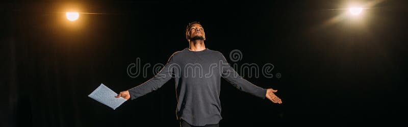 African american actor holding scenario and