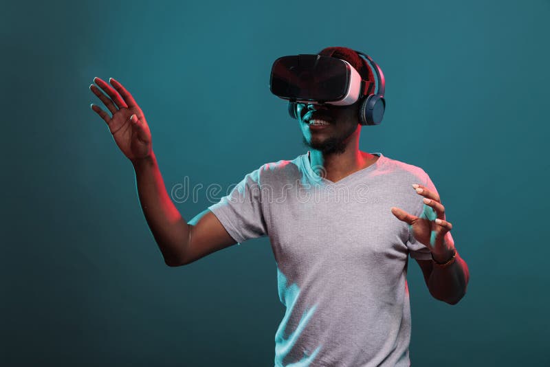 African American Adult Playing Game on Virtual Reality Headset Stock ...
